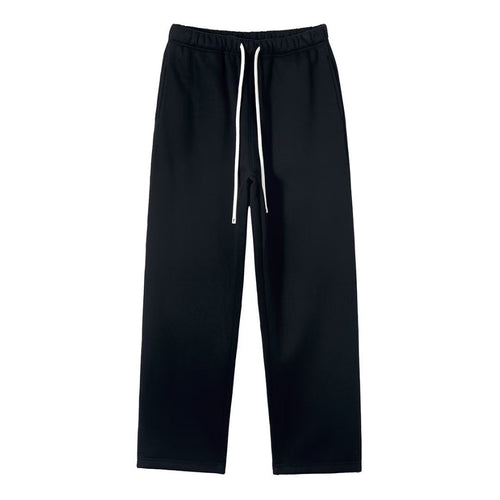 Black sweat pants with a drawstring on a white background